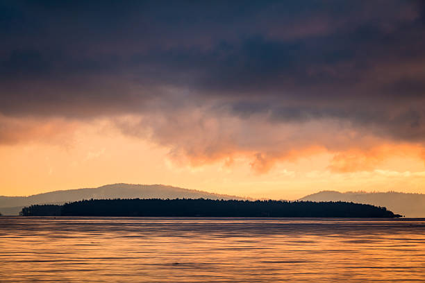Sunrise along the shores of Island View Beach located along southern Vancouver Island.