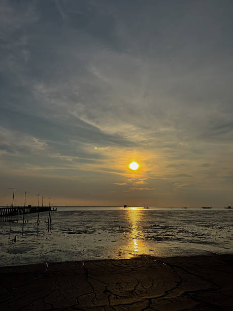 istock sunset on the beach with a view of reddish clouds 2240887208