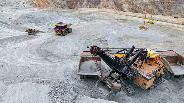 istock A huge mining excavator is excavating and loading minerals onto mining trucks in an open-pit mine 2240888068