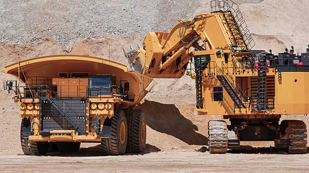 istock A huge mining excavator is excavating and loading minerals onto mining trucks in an open-pit mine 2240888149