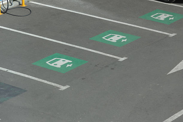 istock Parking spots in a parking lot reserved for electrical vehicles 2240893820