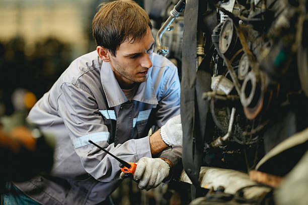 istock Maintenance engineer inspecting rust oily auto motor old spare part in junkyard for reuse service 2240893827