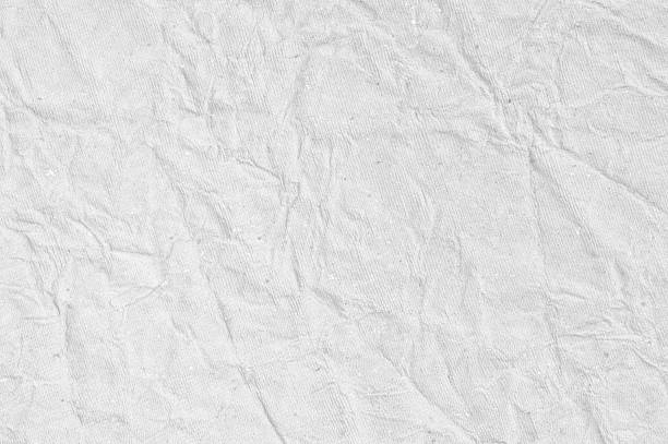 Old blank empty plain textured retro faded gray white crumpled used tissue paper with creases folds wrinkles