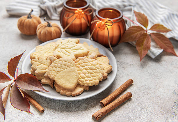 istock Autumn cookies on plate with cinnamon and fall decor 2240900842