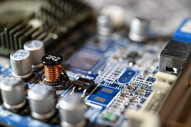 istock Close-up view of an electronic circuit board with connectors, resistors, and components on a blue printed circuit. 2240911607