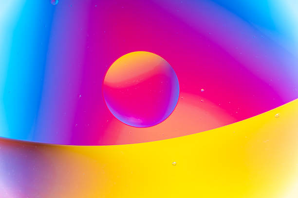 istock Vibrant Blue, Pink, and Yellow Fluid Bubbles Abstract Macro 2240912931
