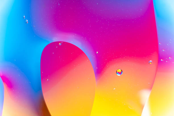 Vibrant Blue, Pink, and Yellow Fluid Bubbles Abstract Macro