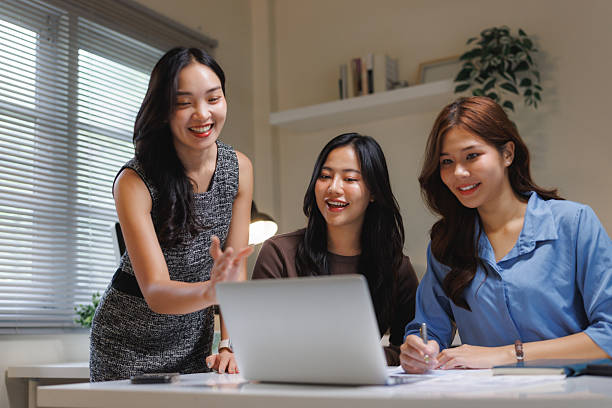 istock Businesswomen collaborating on laptop during office meeting 2240914665