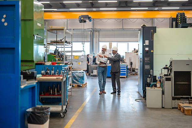 istock Hispanic Manager and Caucasian Engineer Discussing Industrial Processes 2240916546