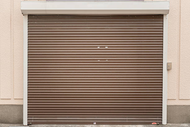 istock Metal sheet roller shutter gate of the garage house. 2240921038