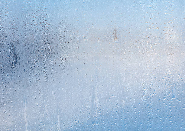 istock Frozen water drops on glass as an abstract background. 2240921736