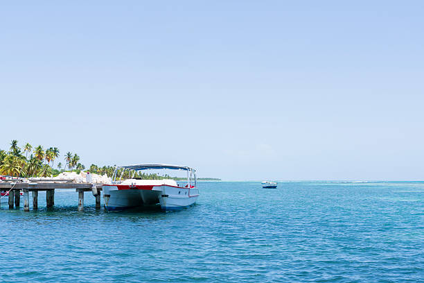 istock Tropical beach and two motorboat moored 2240921783
