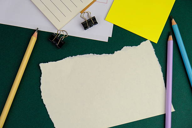 blank paper next to school tools with no word as a template for text space concept. business and education concept