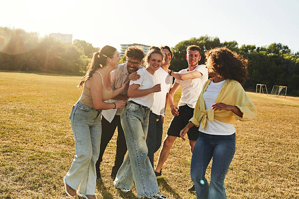 istock Laughing, having fun. Young friends are on the field 2240926469