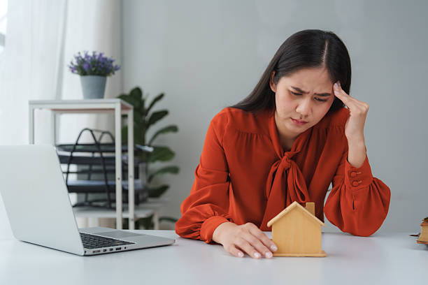 istock Stressed businesswoman having headache while working on laptop at office 2240927093