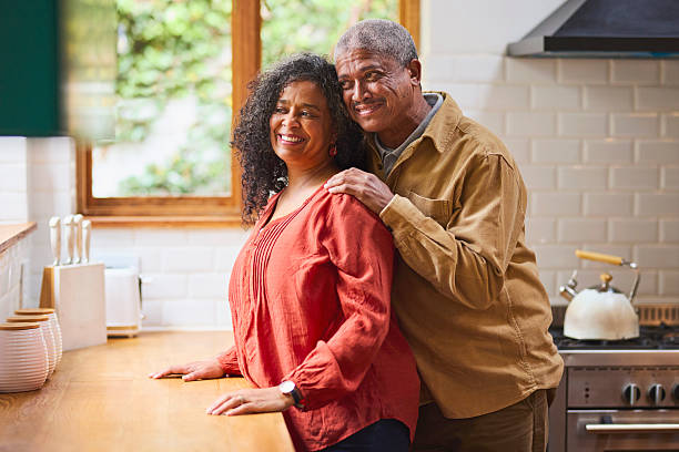 istock Portrait of Affectionate Senior Black Couple in Modern Kitchen 2240927400