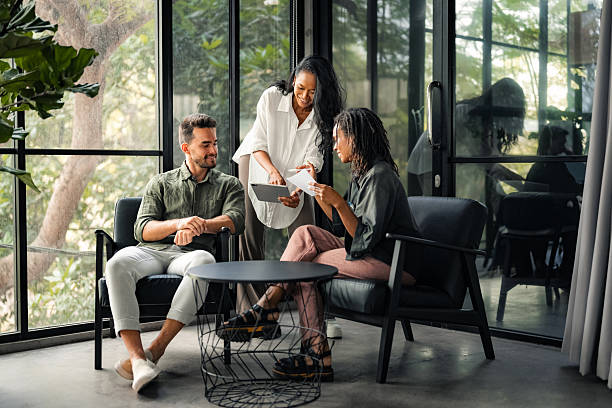 istock Multicultural professional businesspeople working together on research plan in boardroom. 2240931880