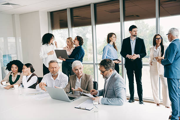 istock Professional team collaborating in a modern office environment with diverse individuals engaged in productive discussions 2240932019
