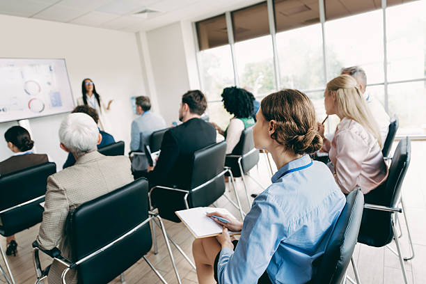 istock Diverse team of professionals engaged in a business presentation in a modern office setting, fostering collaboration. 2240932147