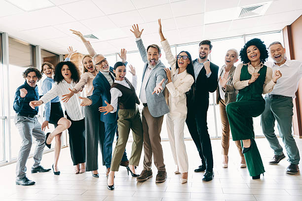 istock Diverse Office Team Celebrating Success While Expressing Joy and Togetherness in a Bright Modern Workspace Setting 2240932323