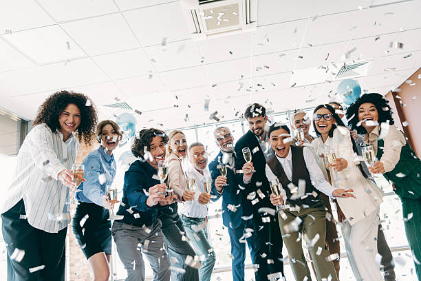 istock Diverse team celebrating together indoors with enthusiasm and joy, showcasing unity and success in a professional office setting 2240932334