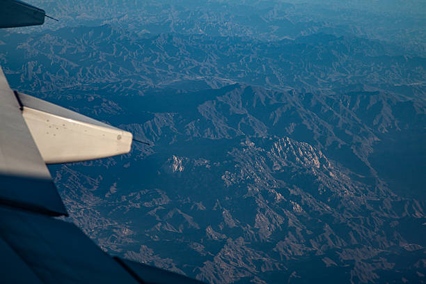 Overlooking the mountains through the airplane window