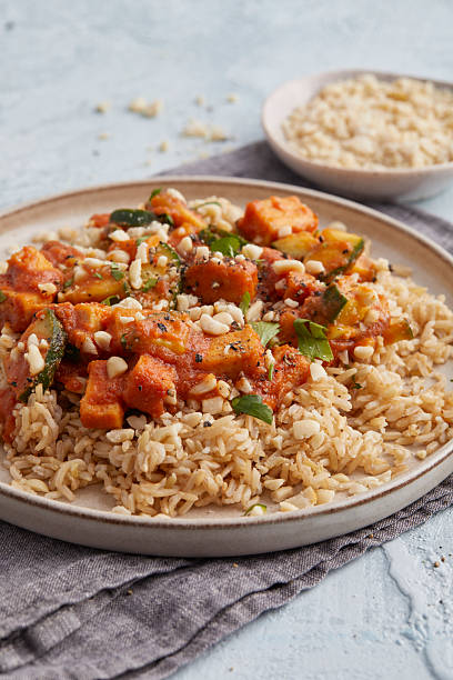 istock Tofu with chili peanut sauce and rice 2240933664