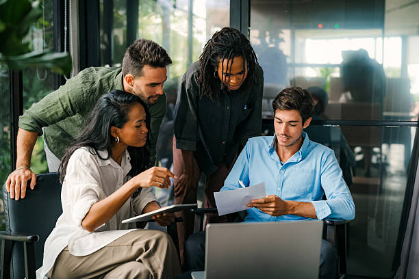istock Group of busy happy diverse professional business team people working in office using digital tablet 2240933968