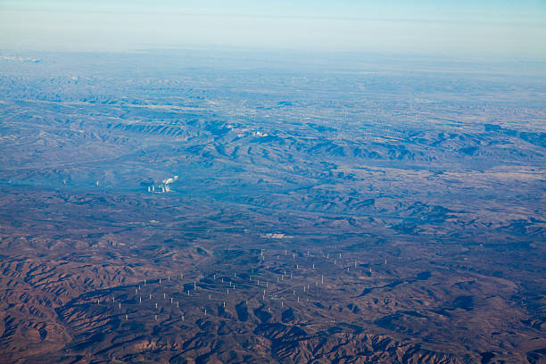istock Overlooking the mountains through the airplane window 2240934671