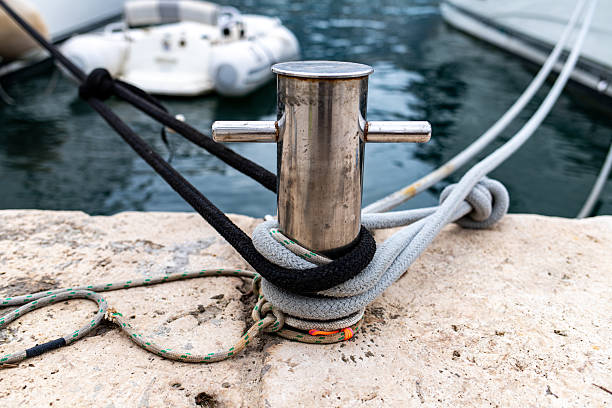 istock Marine ropes secured on steel bollard in harbor 2240936302