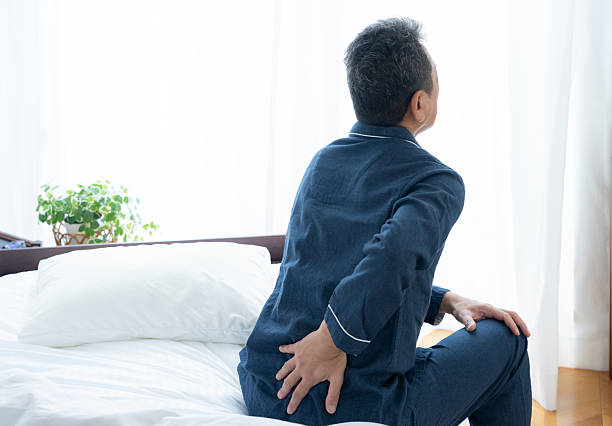 istock middle-aged man waking up in the morning 2240938823