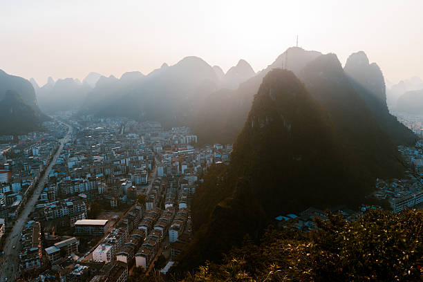 Yangshuo town surrounded by Guilin Hills in China at sunset