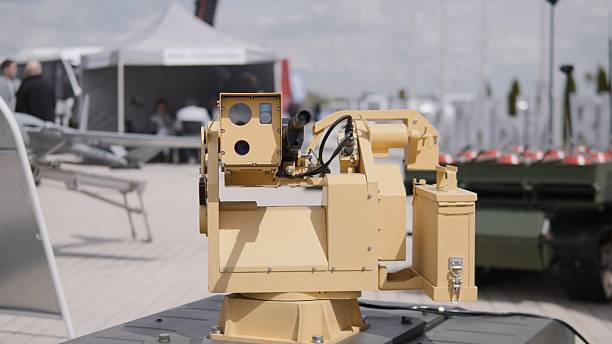 istock Military Robotics Showcase Features Advanced Weapon Systems at Defense Exhibition in Outdoor Venue During Daytime Event 2240939290