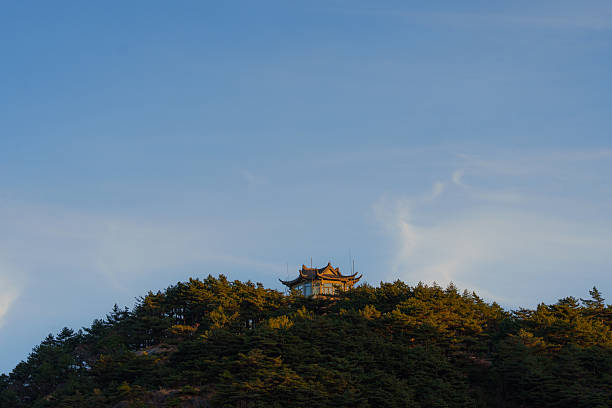 Scenic view of chinese pavilion in Huangshan mountains at sunset