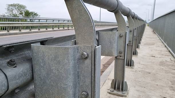 istock Close-up of galvanized metal bridge railing with bolts and nuts 2240941089