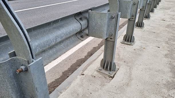 istock Close-up view of a galvanized steel bridge guardrail and road barrier structure 2240941108