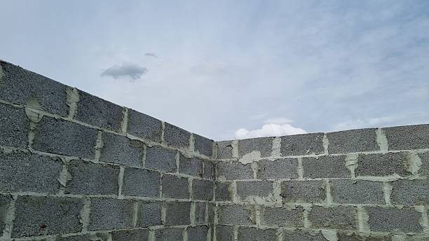istock Corner of Unfinished Concrete Wall and Sky 2240941209