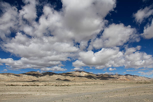 istock Vast desert landscape under a blue sky with scattered clouds 2240941654