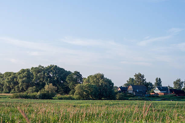 istock Peaceful rural landscape with a farmstead and fields in the distance 2240941794