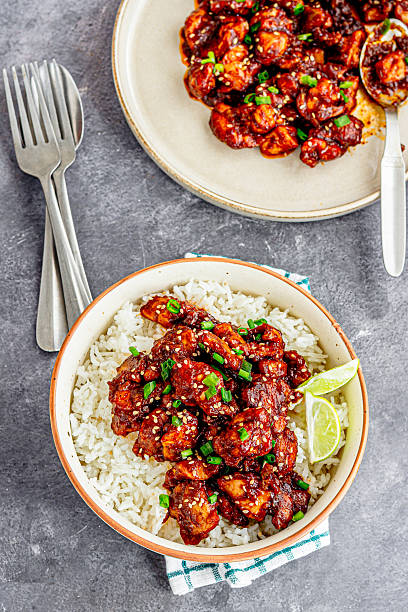 istock Asian Stir-Fried Chicken Over Rice Top Down Photo 2240943733