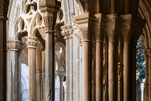 Street view in Santiago de Compostela, arcade, stone columns in a row, diminishing perspective. Galicia, Spain.