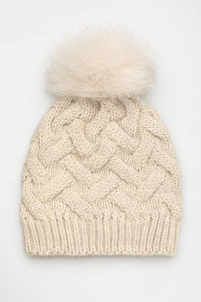 istock Beige Knitted Winter Hat with Pom Pom 2240952682