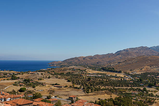 istock Scenic coastal landscape with hills and sea under clear blue sky. 2240952784