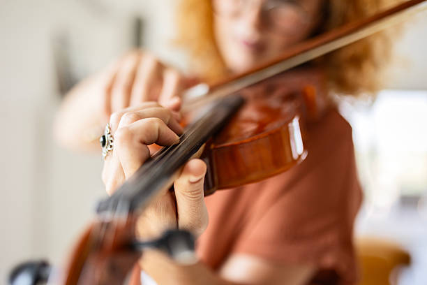 istock Violinist Rehearsing in Cozy Home Setting 2240955772