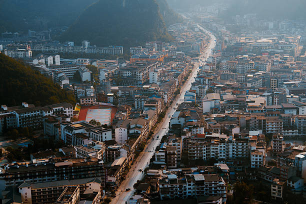 Scenic high angle view from mountain at town in Yangshuo, Guilin, China at sunset