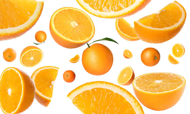 istock Fresh oranges swirling in air against white background. Citrus fruit 2240958197