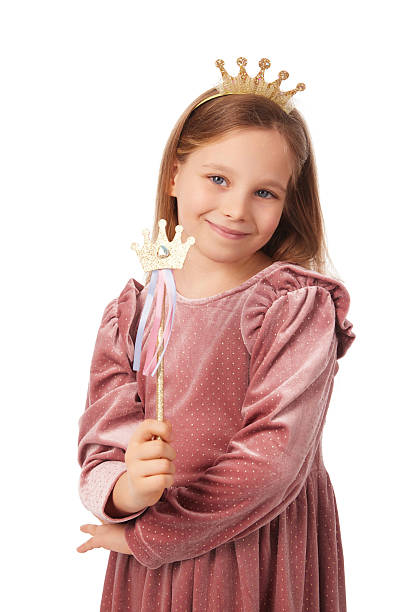 istock Smiling girl wearing crown and holding magic wand posing on white background 2240959691