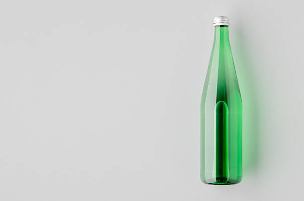 istock Green glass water bottle mockup 2240962940
