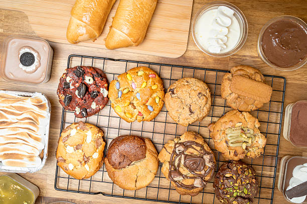 Assortment of gourmet cookies and desserts on wooden table