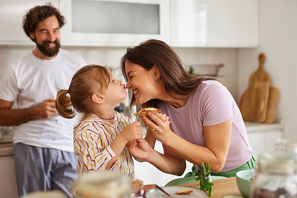 istock Happy family sharing loving moment at home kitchen 2240963201